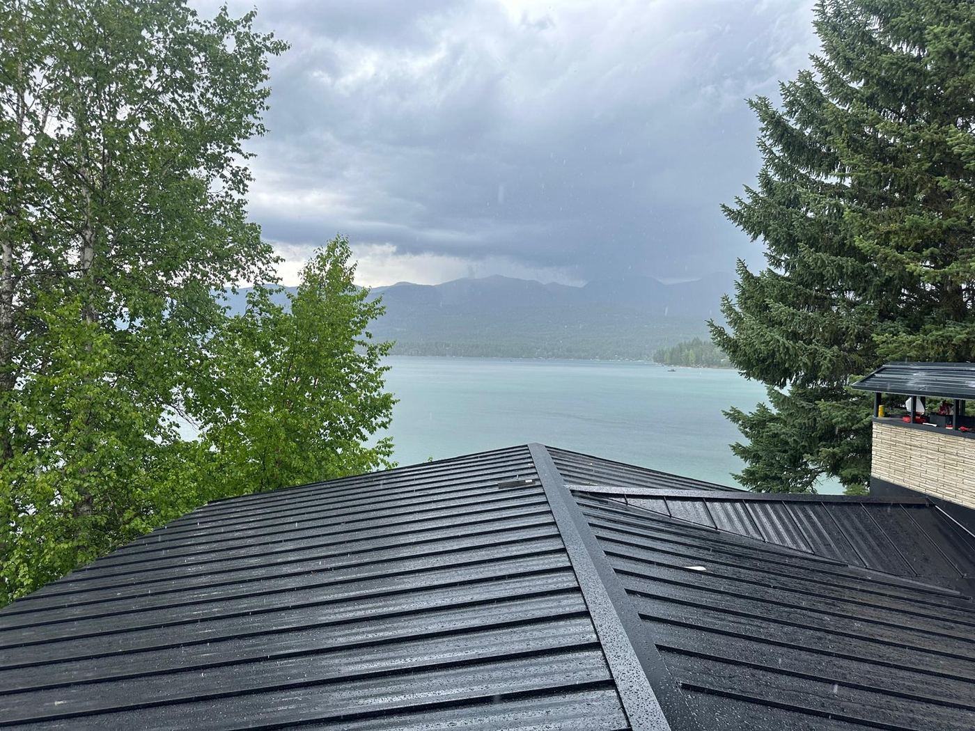 Finished standing seam metal roof overlooking a lake